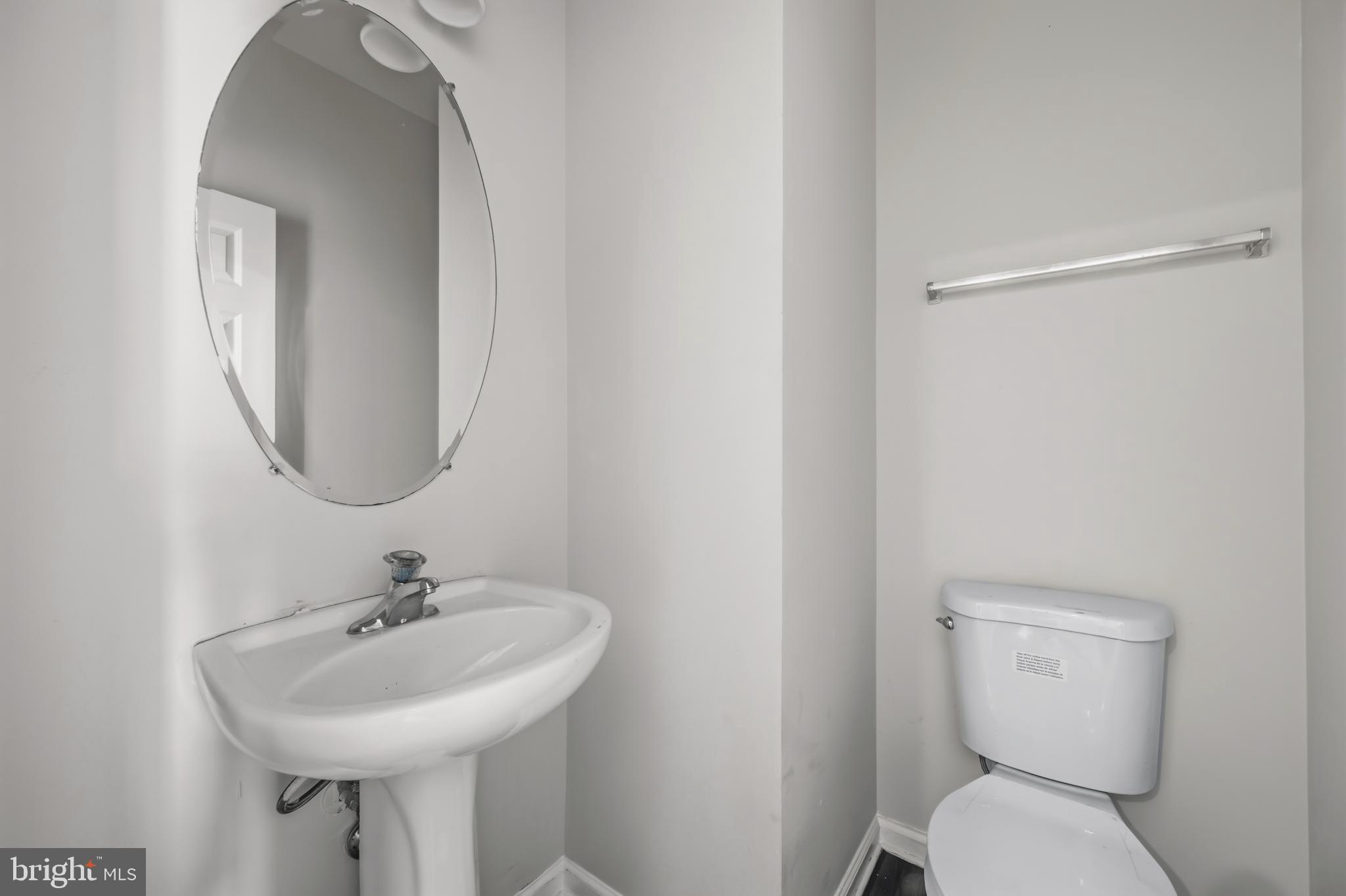 146 Danbury Street Southwest Washington, DC 20032 - Photo 14 of 40 a bathroom with a toilet sink and mirror