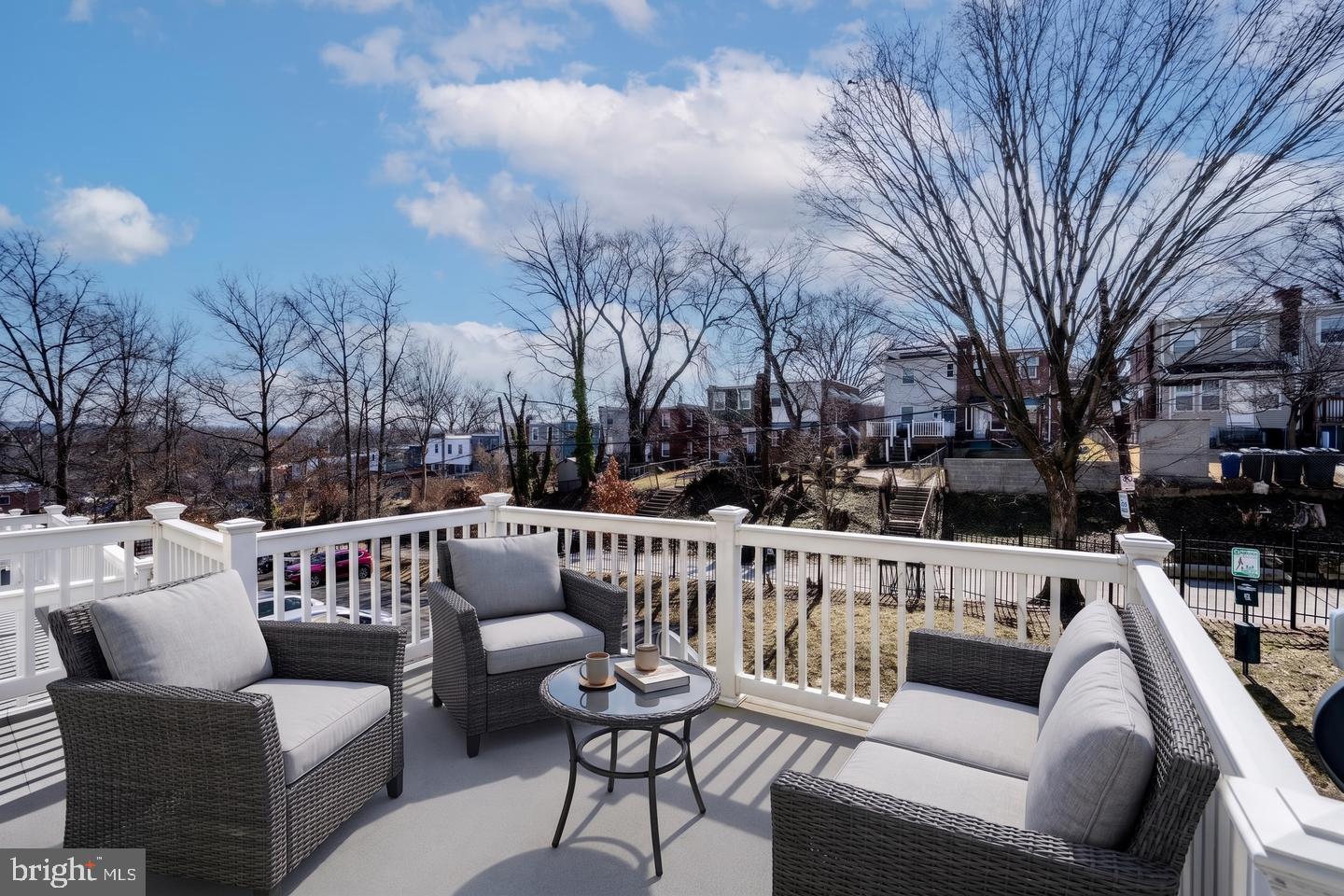 146 Danbury Street Southwest Washington, DC 20032 - Photo 23 of 40 a roof deck with couches and wooden floor