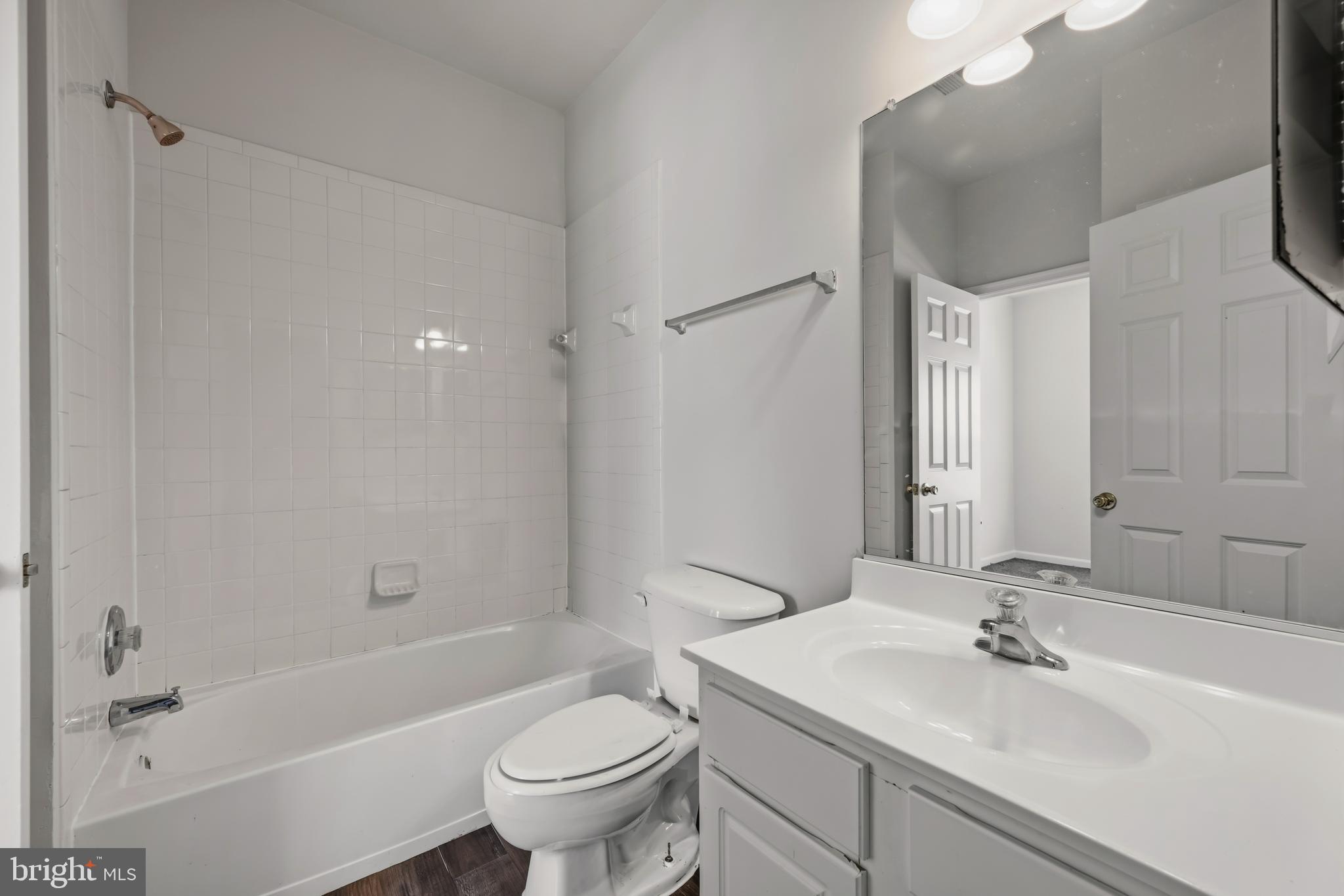 146 Danbury Street Southwest Washington, DC 20032 - Photo 29 of 40 a bathroom with a sink toilet and shower
