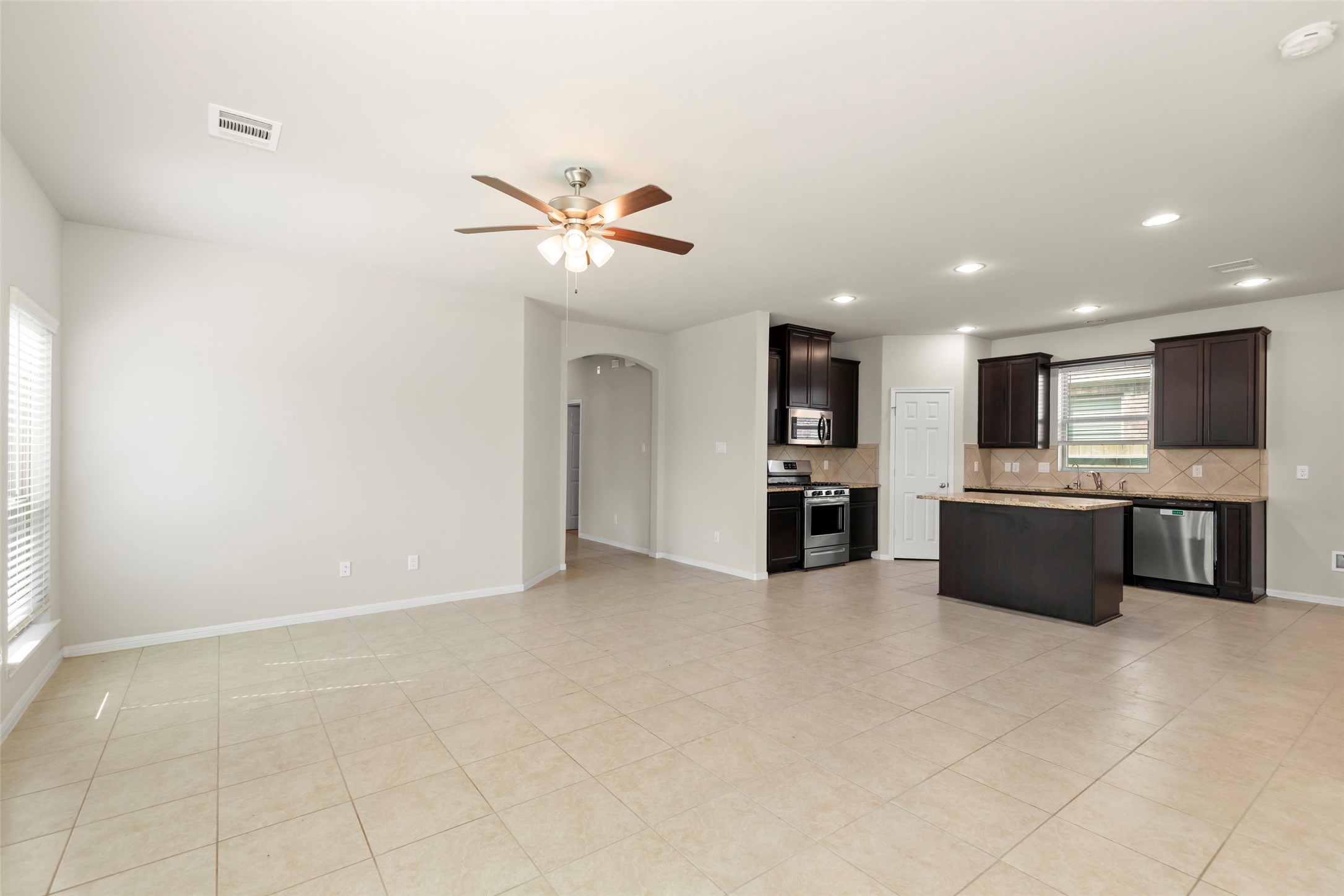 1333 Red Hills Drive Rosharon, TX 77583 - Photo 11 of 29 a large white kitchen with a large window and kitchen view