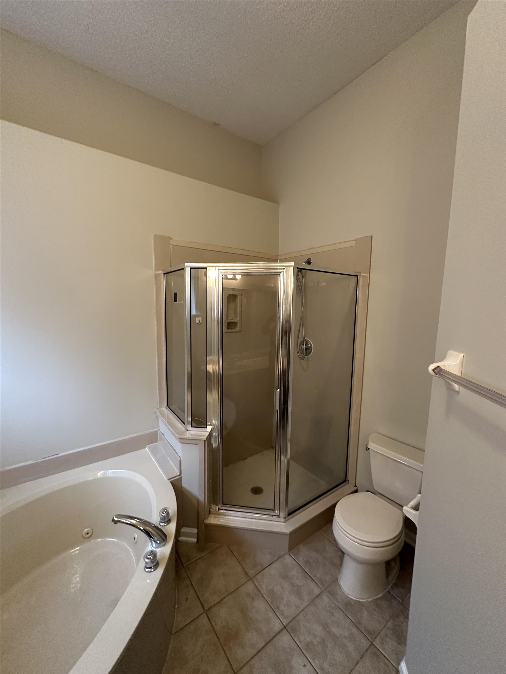10144 Lynham Drive Cordova, TN 38016 - Photo 9 of 15 a bathroom with a granite countertop bathtub shower and toilet