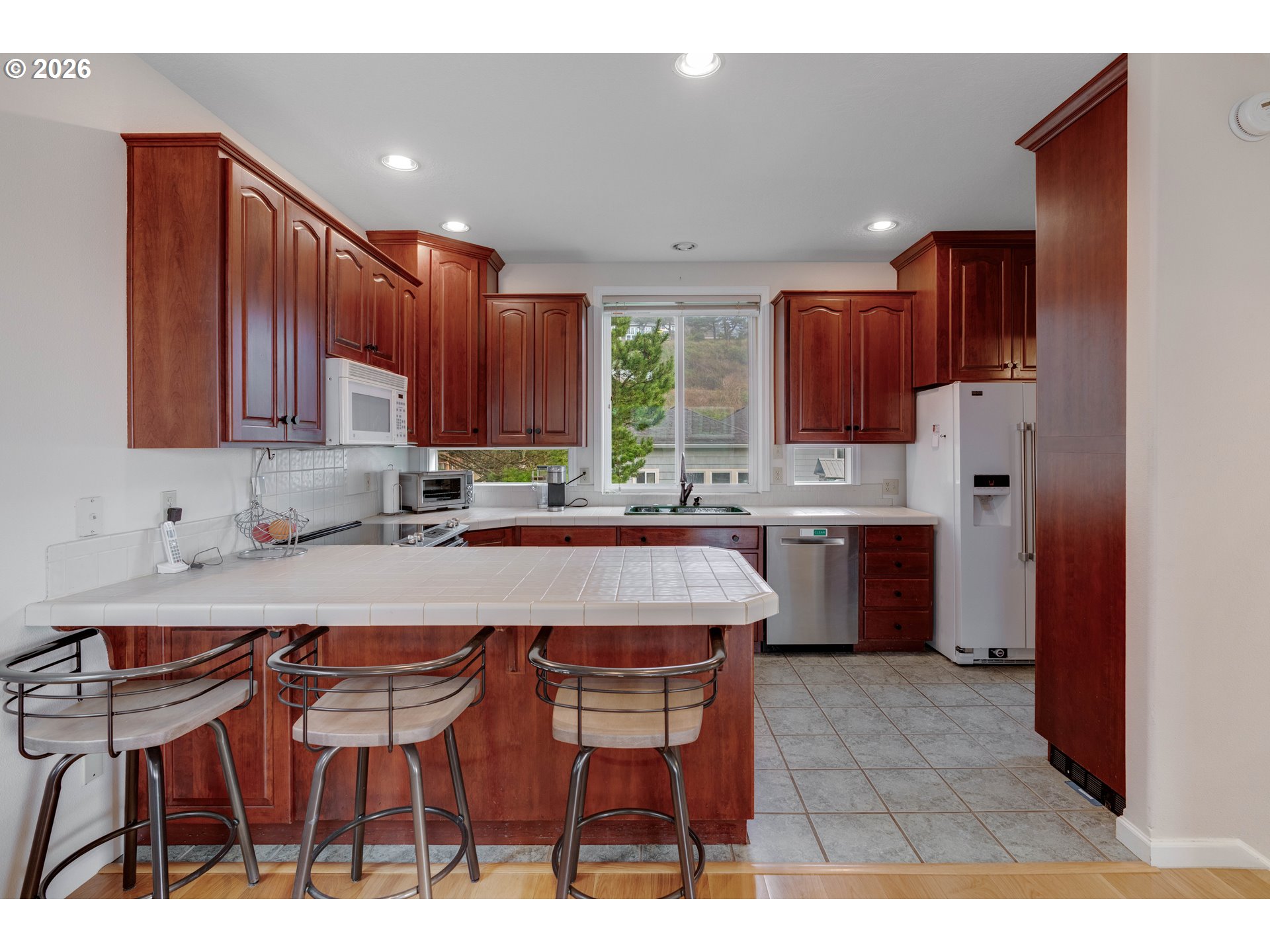1435 Sunset Avenue Oceanside, OR 97141 - Photo 11 of 46 a kitchen with a sink cabinets and window