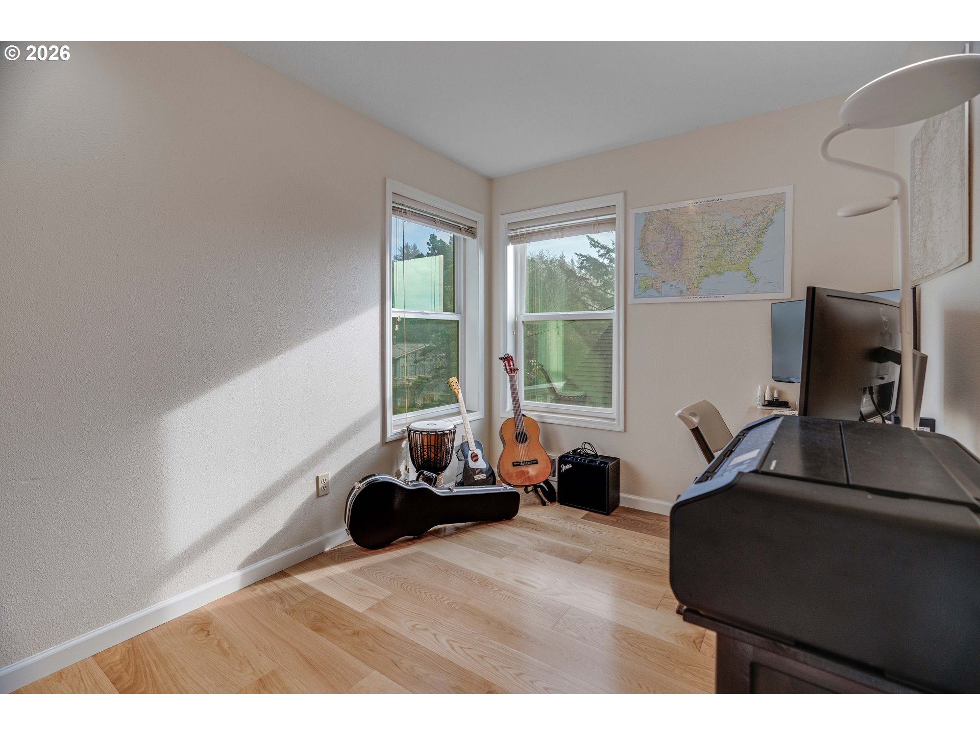 1435 Sunset Avenue Oceanside, OR 97141 - Photo 16 of 46 a living room with furniture a large window and a flat screen tv