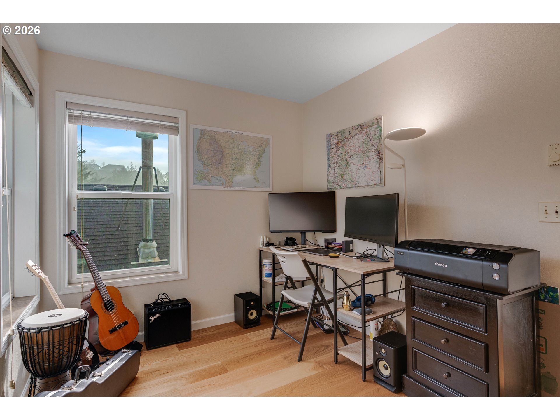 1435 Sunset Avenue Oceanside, OR 97141 - Photo 18 of 46 a view of a workspace with furniture and a window