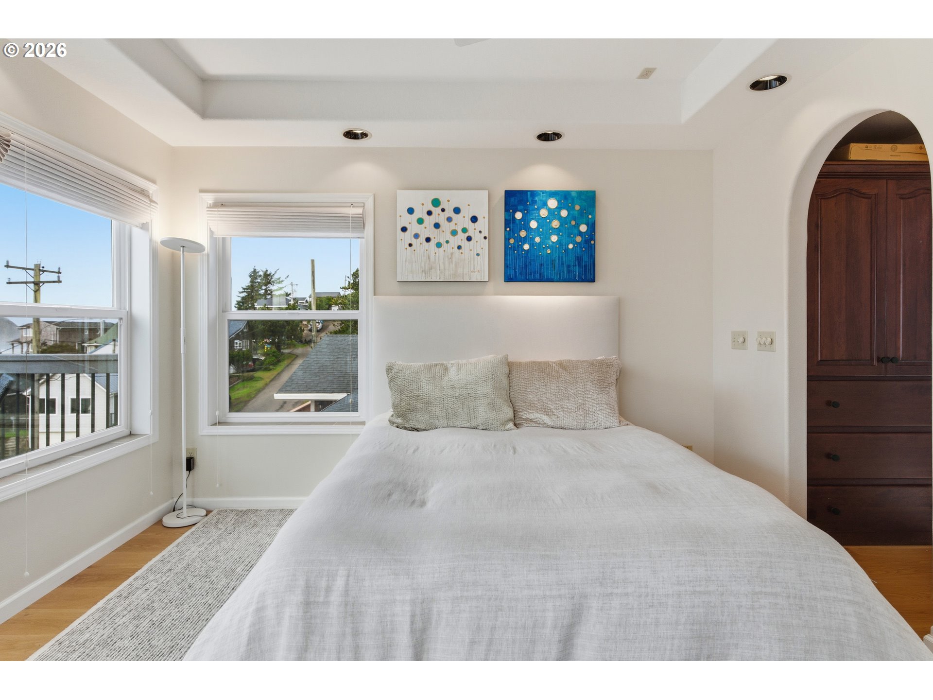 1435 Sunset Avenue Oceanside, OR 97141 - Photo 20 of 46 a bedroom with a large bed and a window