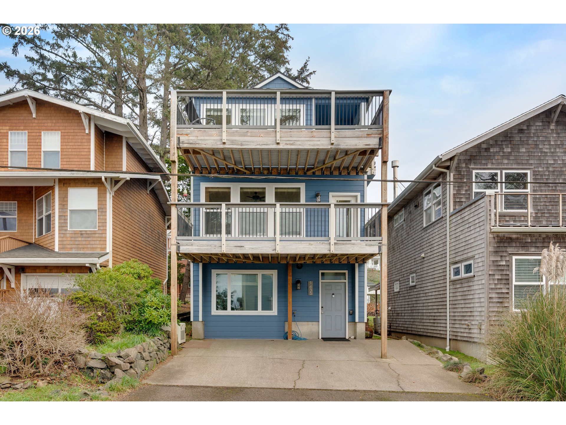 1435 Sunset Avenue Oceanside, OR 97141 - Photo 2 of 46 a front view of a house with a garden