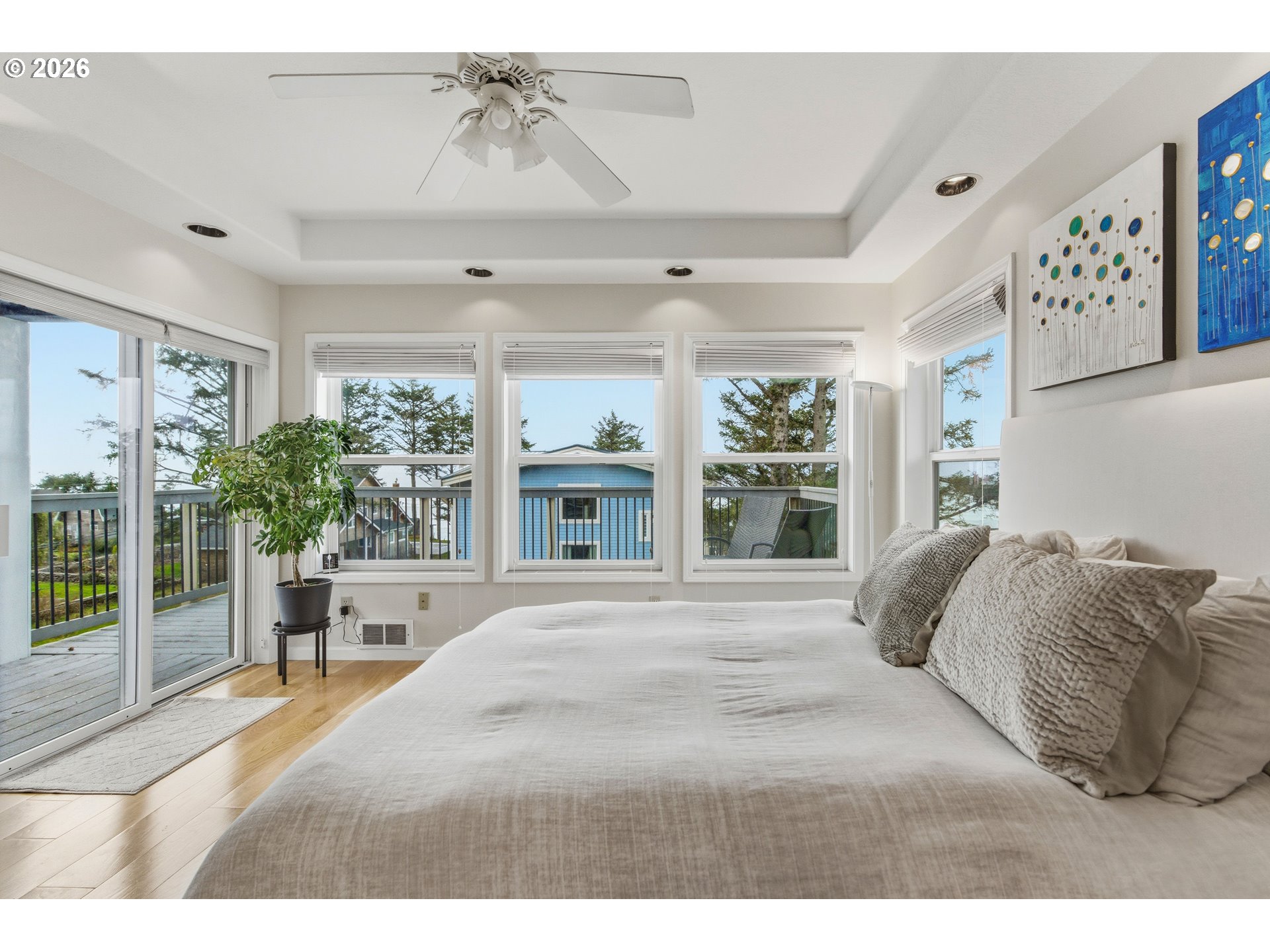 1435 Sunset Avenue Oceanside, OR 97141 - Photo 21 of 46 a bedroom with a large bed and a window