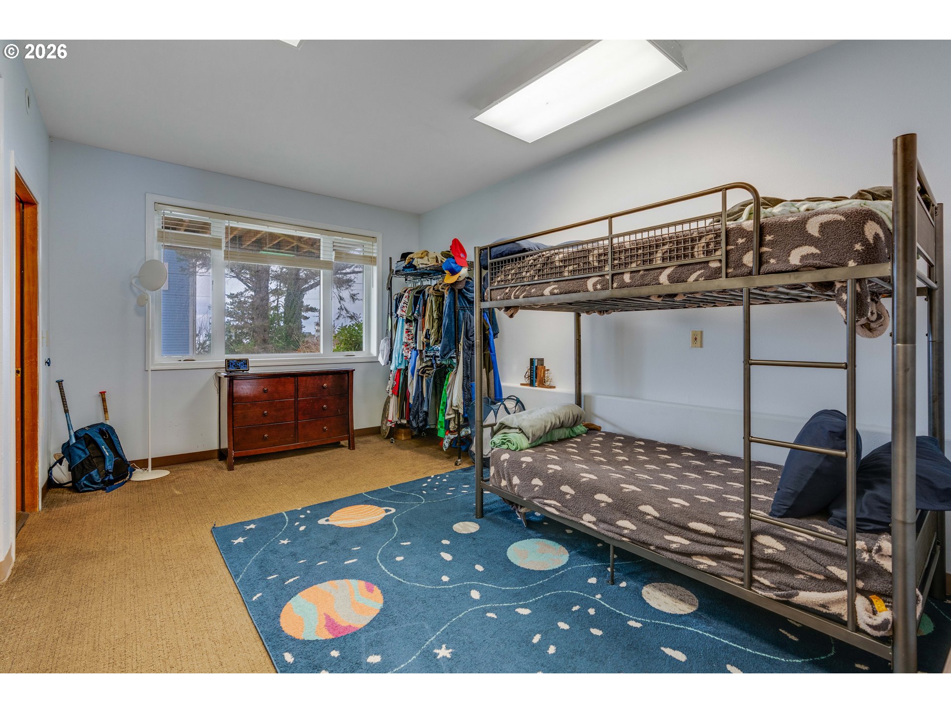 1435 Sunset Avenue Oceanside, OR 97141 - Photo 27 of 46 a bedroom with a bed and a view of bathroom