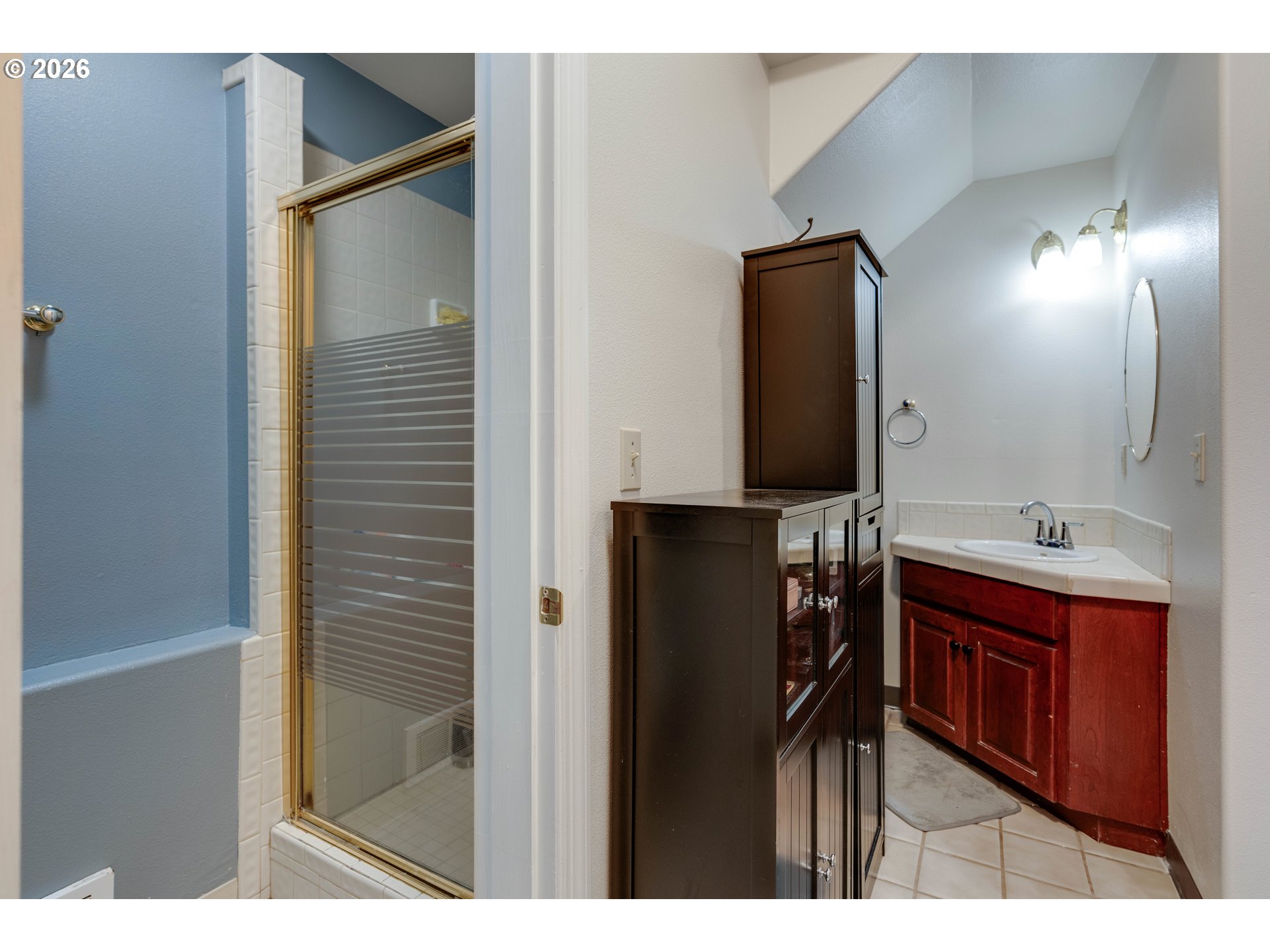1435 Sunset Avenue Oceanside, OR 97141 - Photo 30 of 46 a bathroom with a sink and a mirror