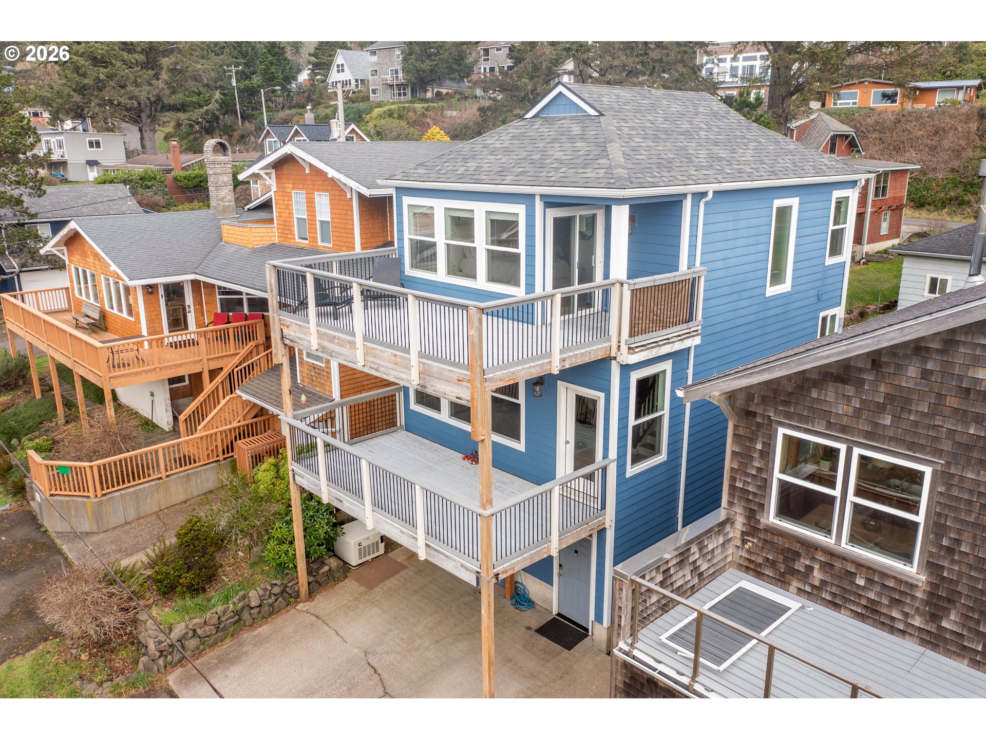 1435 Sunset Avenue Oceanside, OR 97141 - Photo 37 of 46 a view of a large building next to a yard