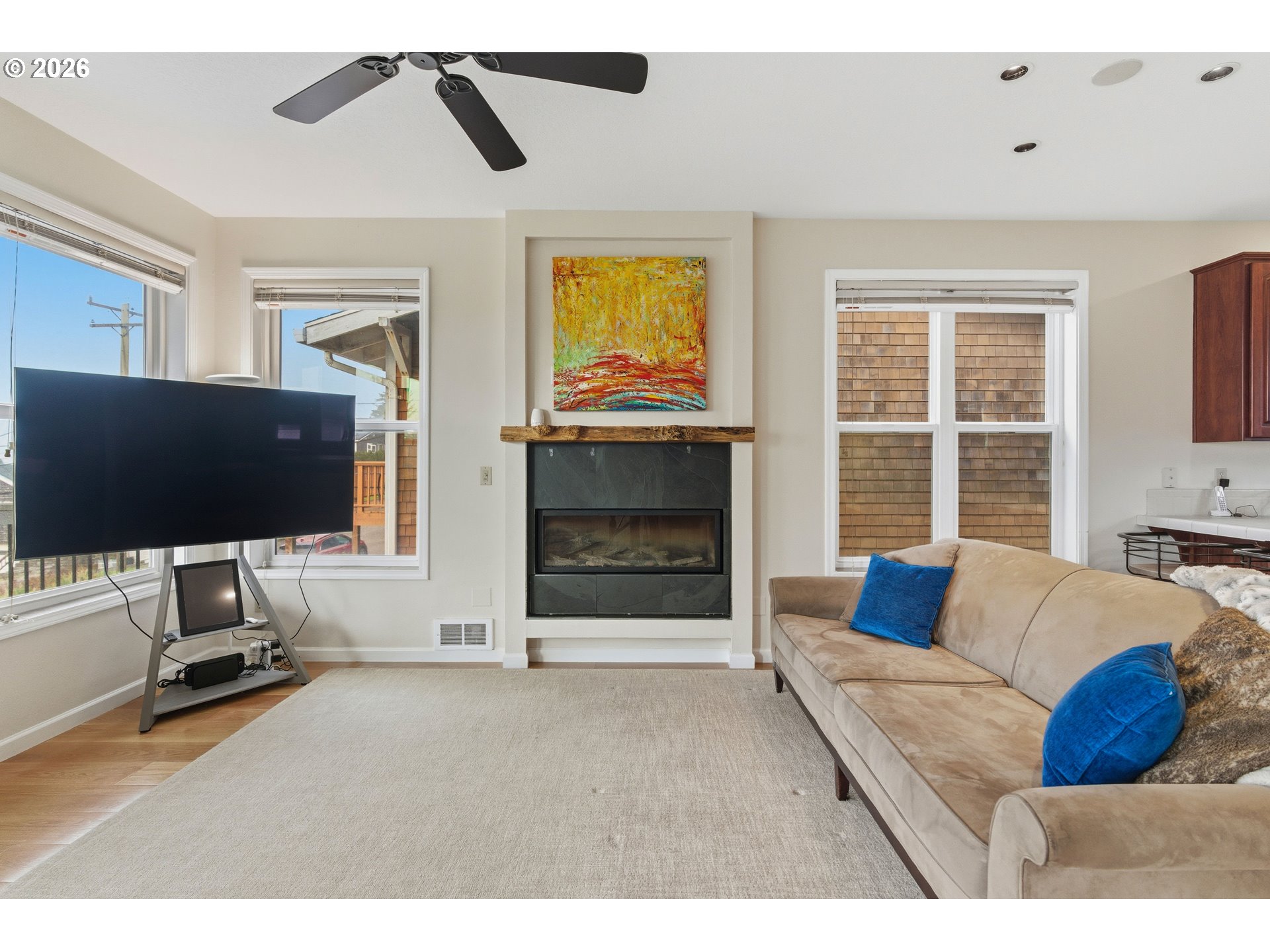 1435 Sunset Avenue Oceanside, OR 97141 - Photo 6 of 46 a living room with furniture and a flat screen tv