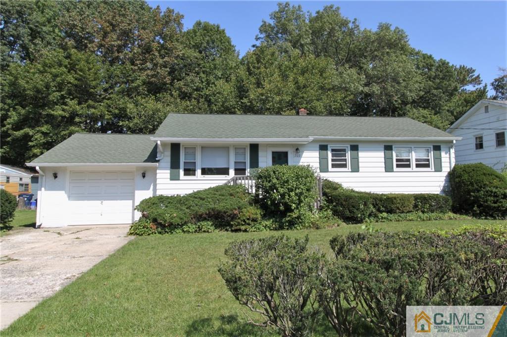 709 Myrtle Road North Brunswick, NJ 08902 - Photo 1 of 16 a front view of a house with a yard and trees