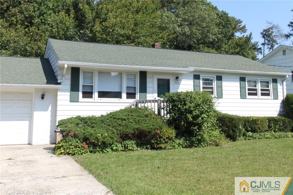709 Myrtle Road North Brunswick, NJ 08902 - Photo 2 of 16 a front view of a house with a yard
