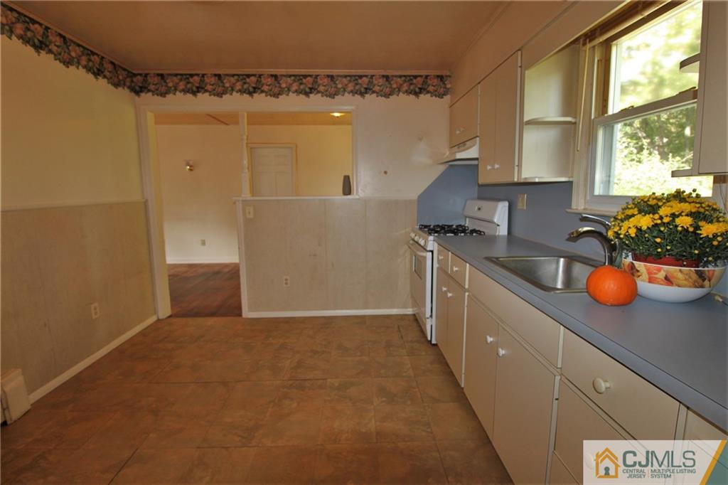 709 Myrtle Road North Brunswick, NJ 08902 - Photo 5 of 16 a kitchen with a sink and cabinets