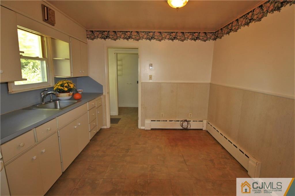 709 Myrtle Road North Brunswick, NJ 08902 - Photo 7 of 16 a bathroom with a sink and a shower