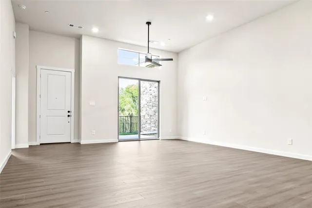 a large kitchen with stainless steel appliances granite countertop a large counter top a sink and a stove