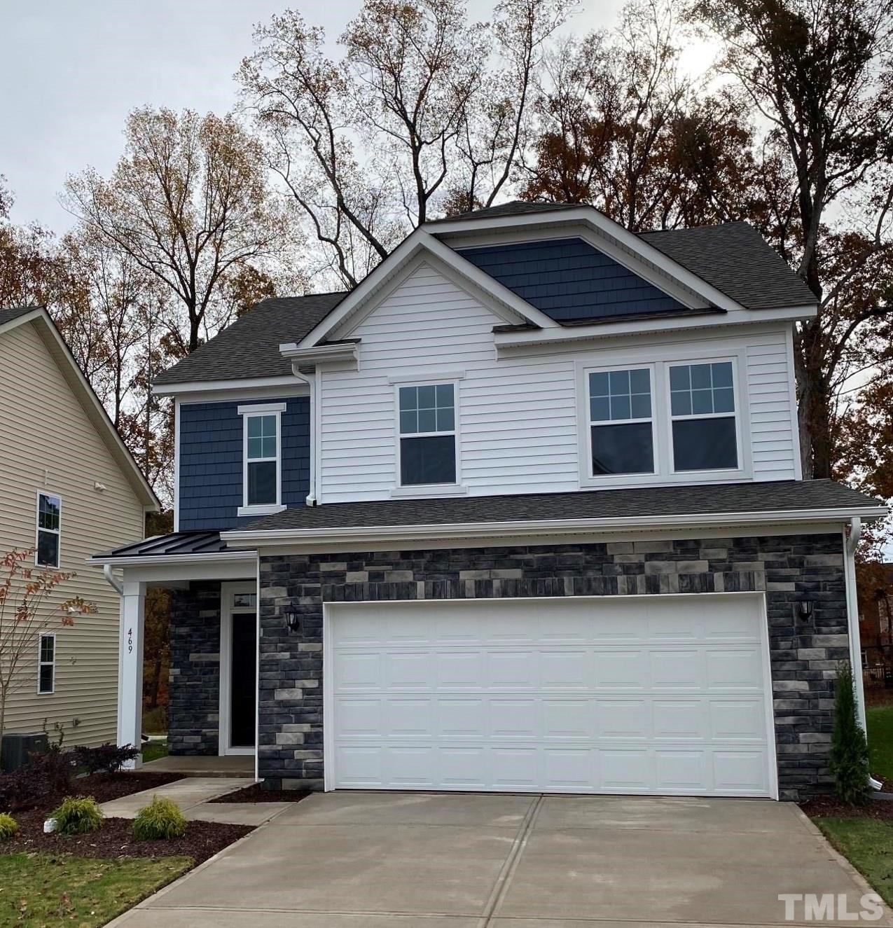 a front view of a house with garage