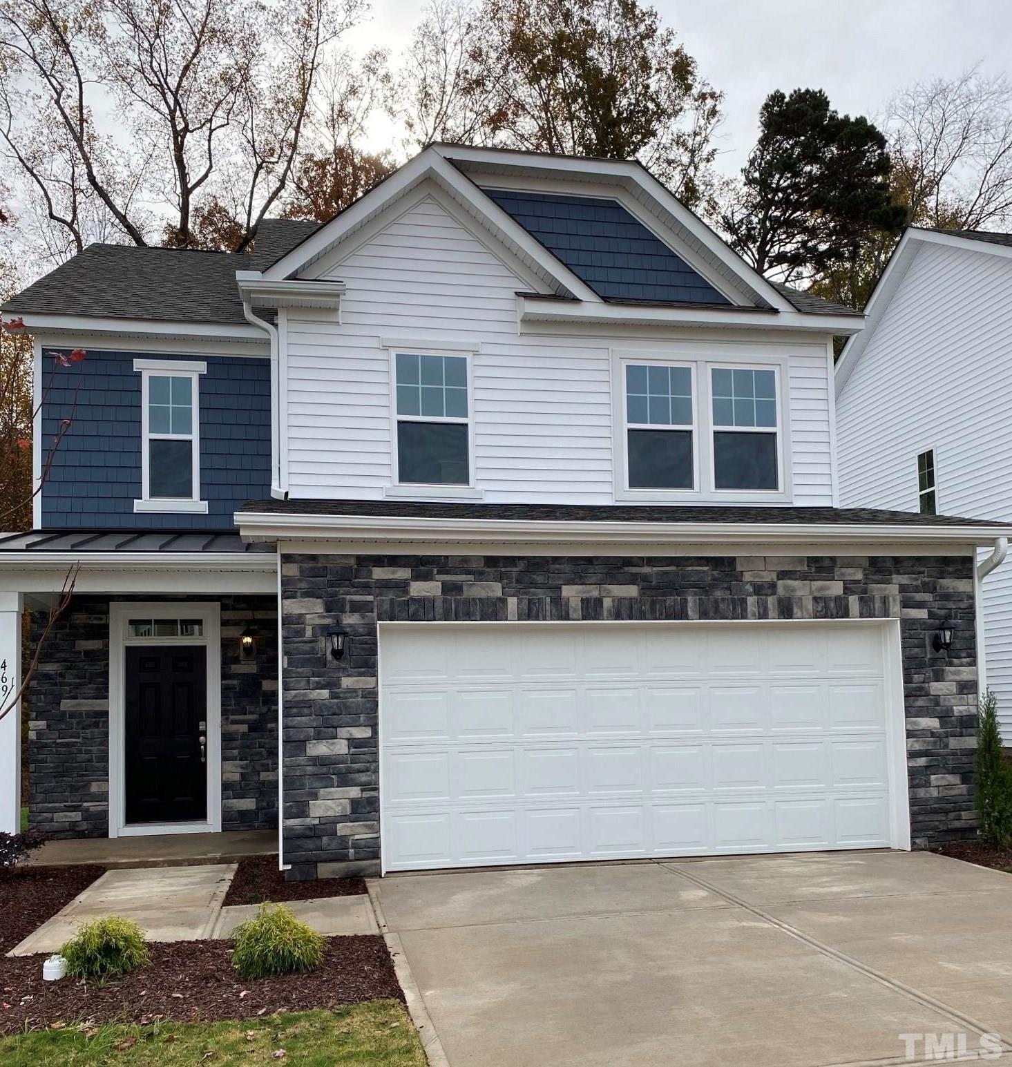 469 Whitley Rdg Drive Clayton, NC 27527 - Photo 2 of 6 a front view of a house with a garden