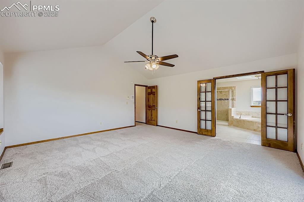 5825 Wilson Road Colorado Springs, CO 80919 - Photo 26 of 48 a view of an empty room with a ceiling fan