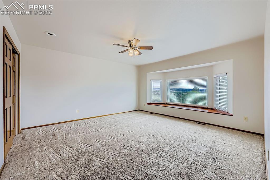5825 Wilson Road Colorado Springs, CO 80919 - Photo 30 of 48 a view of an empty room with a window