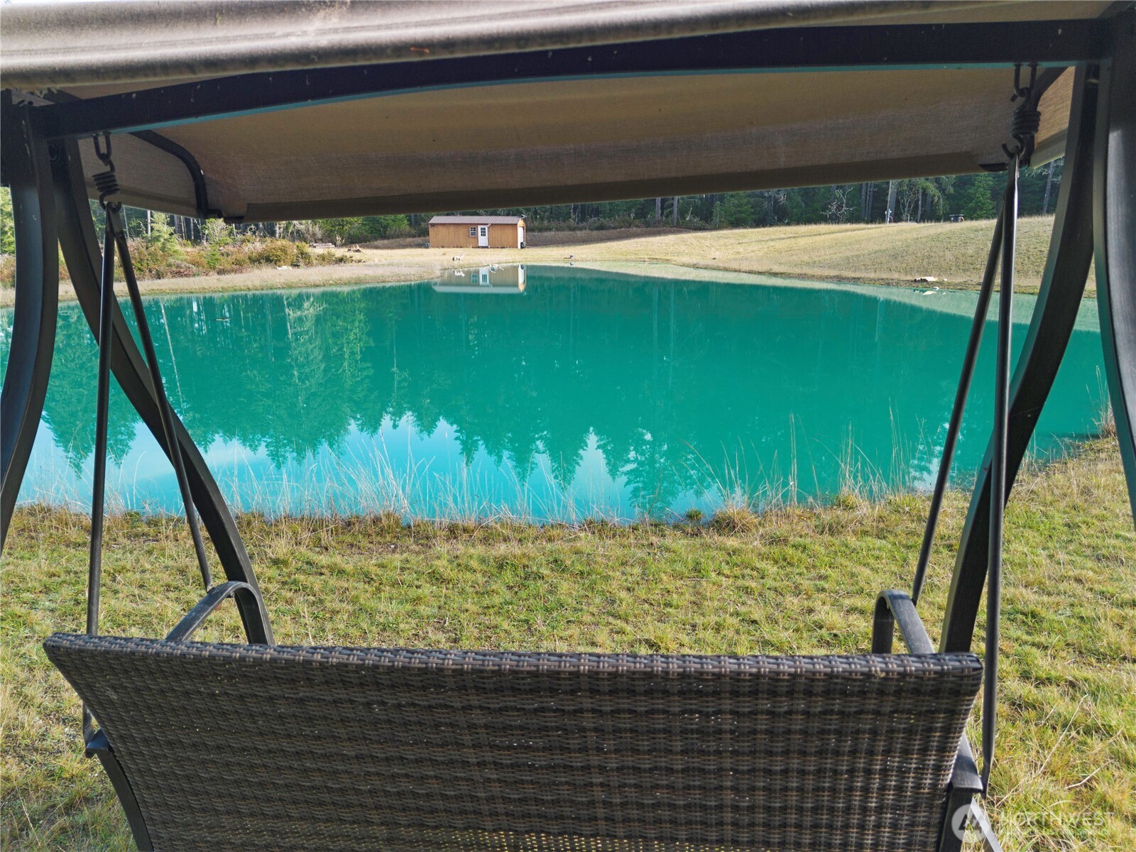151 East Kingsley Place Belfair, WA 98528 - Photo 18 of 40 a view of a lake from a balcony