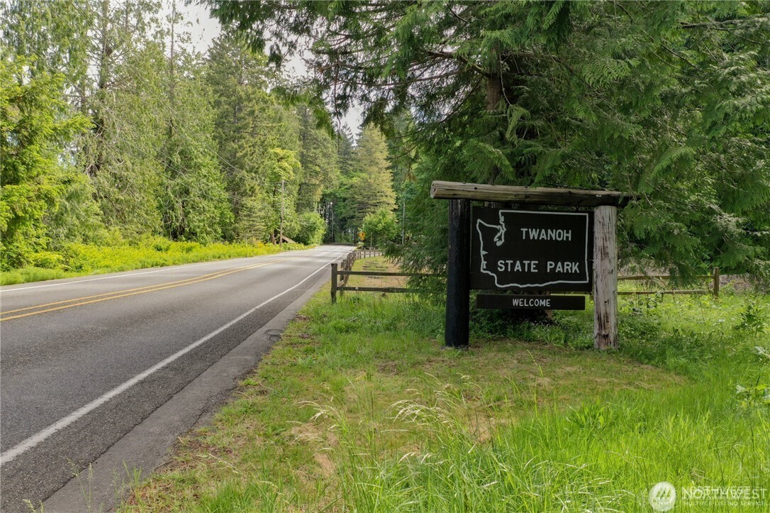 151 East Kingsley Place Belfair, WA 98528 - Photo 37 of 40 a view of a park that has a sign on it
