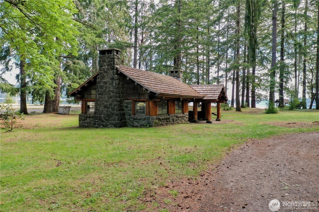 151 East Kingsley Place Belfair, WA 98528 - Photo 38 of 40 a front view of a house with a yard
