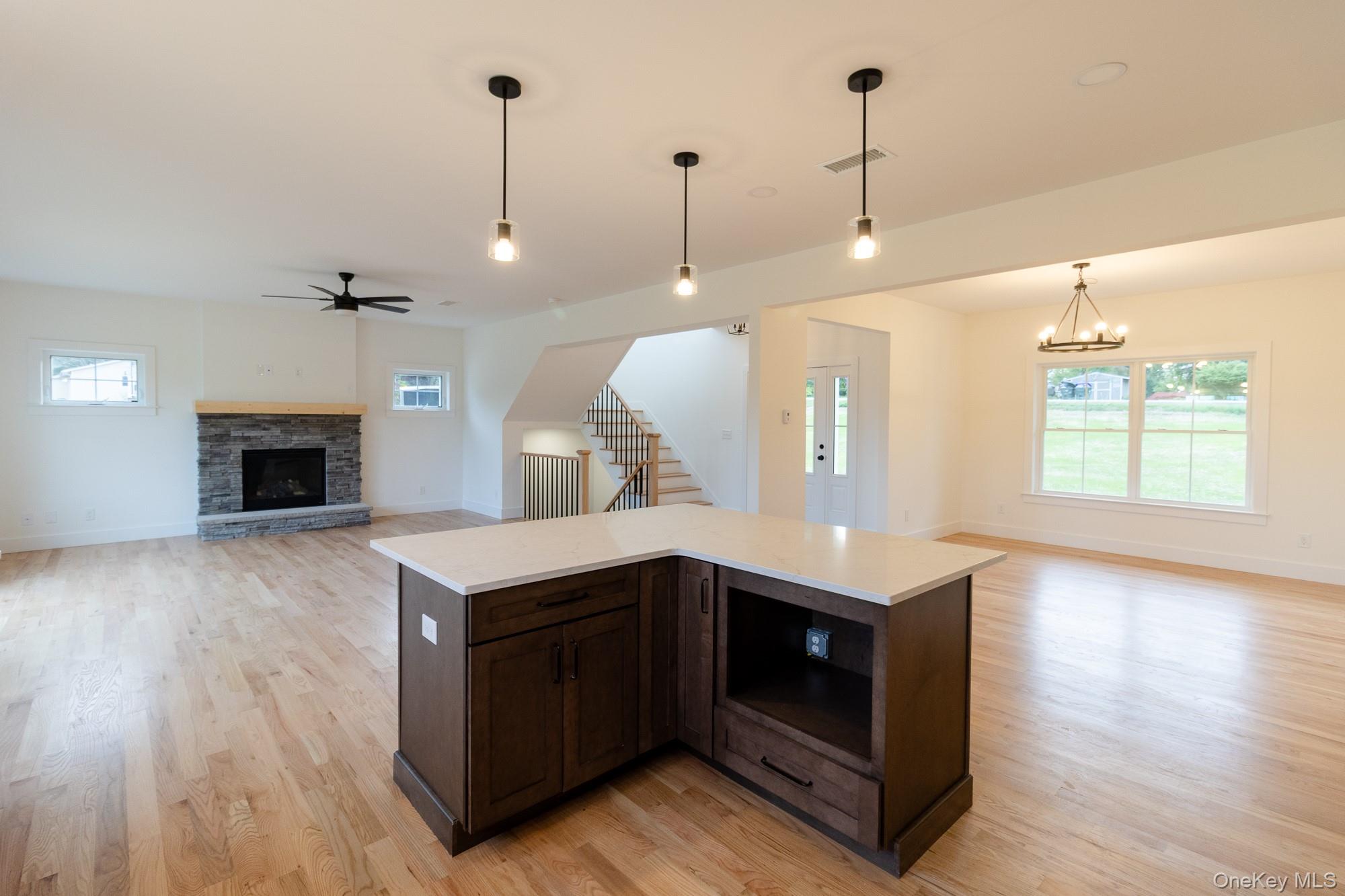 750 Ridgebury Road Slate Hill, NY 10973 - Photo 13 of 41 a kitchen with a stove and a wooden floor
