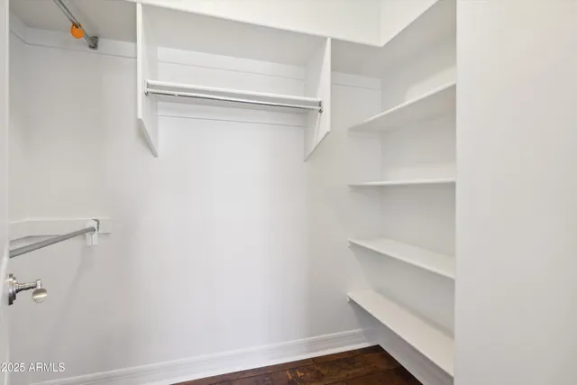 a view of an empty walk in closet