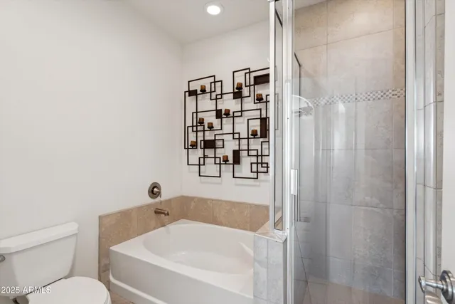 a bathroom with a bathtub and shower