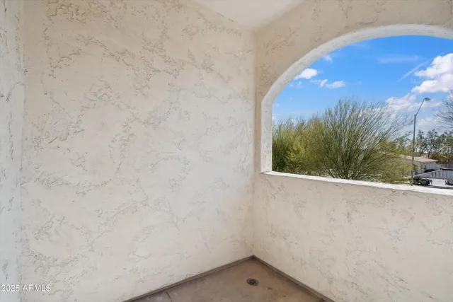 a view of balcony with wooden floor