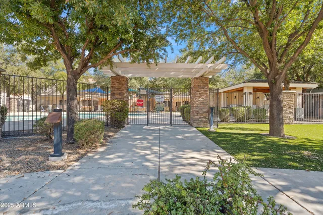 a swimming pool with outdoor seating and yard