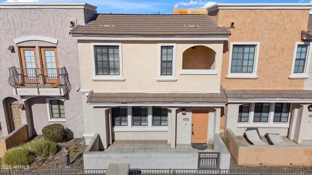 an aerial view of residential houses with city view