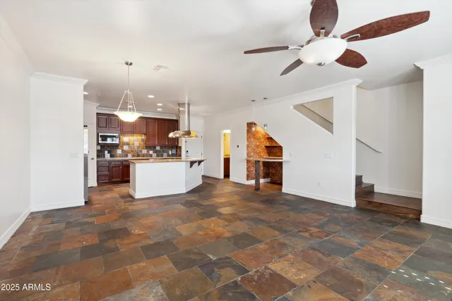 a view of a kitchen with furniture and a kitchen
