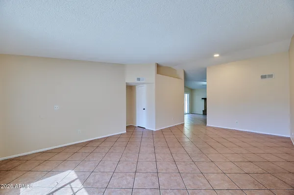 a view of an empty room and a window