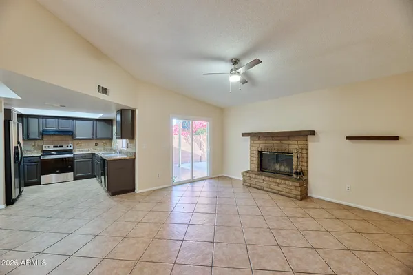 a large kitchen with cabinets and stainless steel appliances
