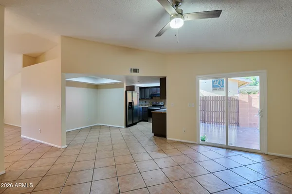 a view of a kitchen with a sink and dishwasher cabinets