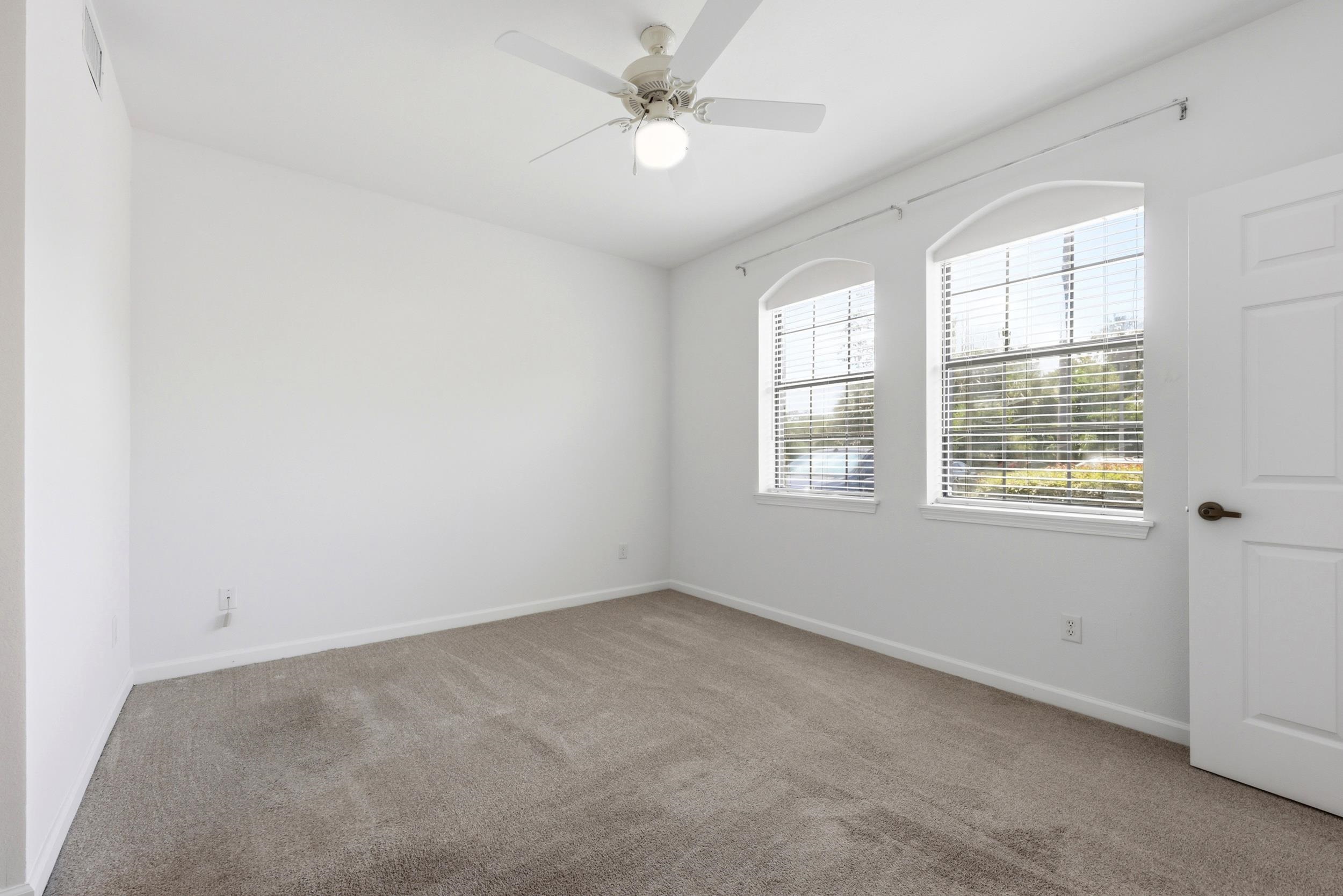 2500 Vista Cove Road St. Augustine, FL 32084 - Photo 24 of 53 an empty room with a window and a ceiling fan