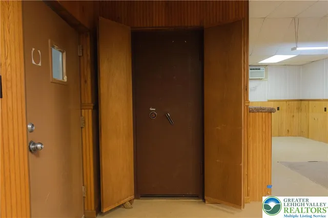 a view of an empty room with closet