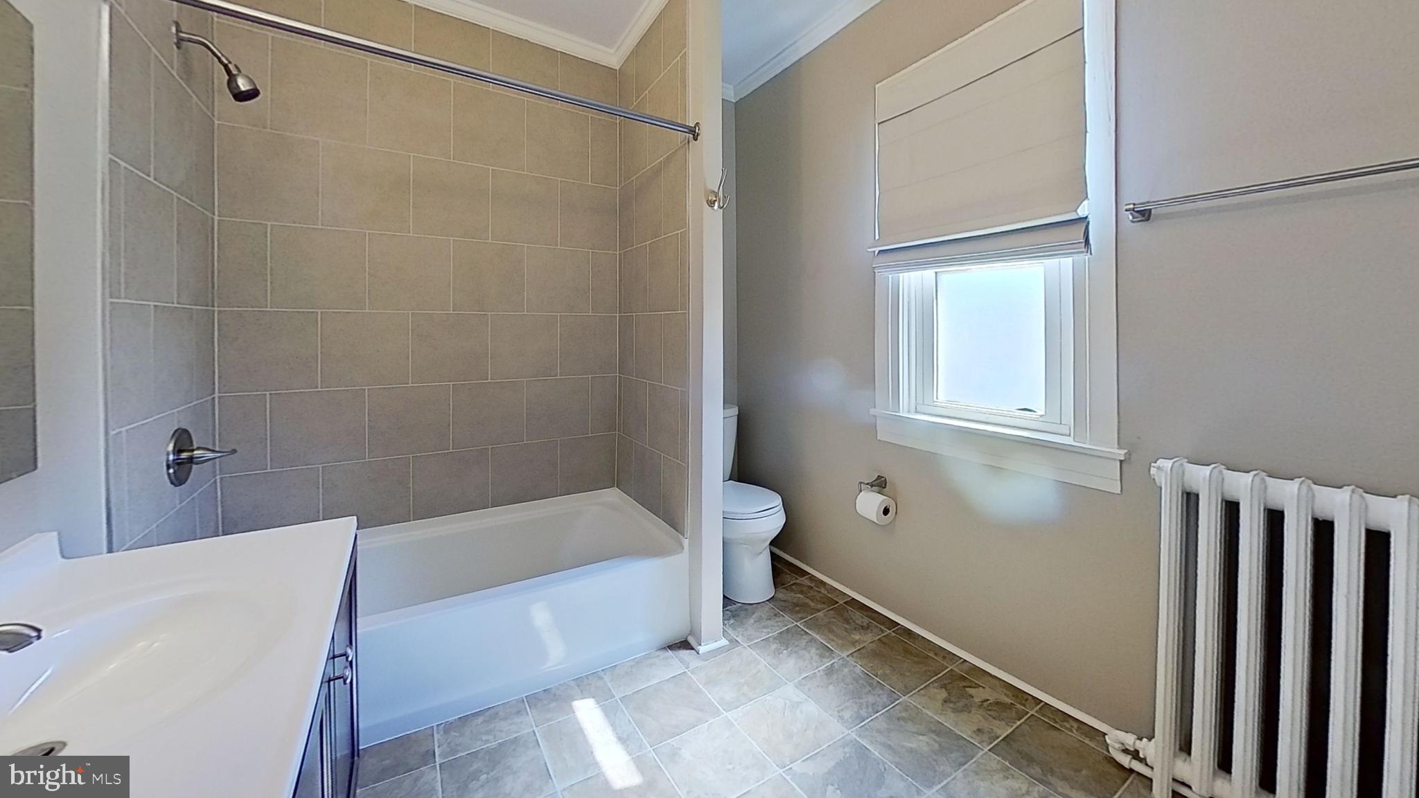 549 Lancaster Avenue York, PA 17403 - Photo 8 of 11 a bathroom with a bathtub and a shower