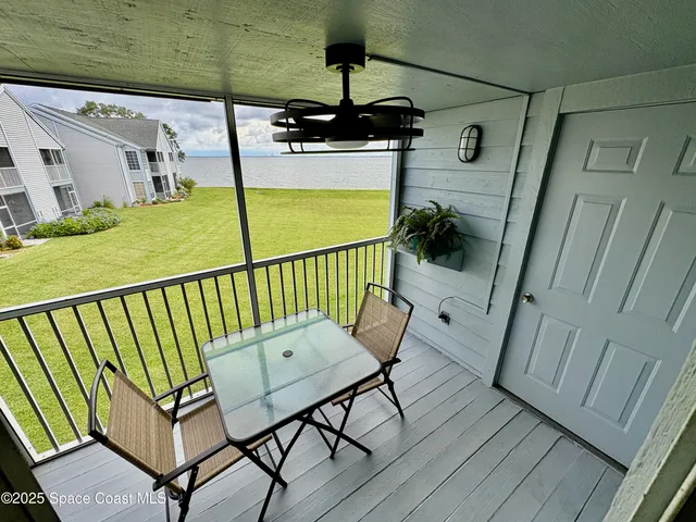 a view of a balcony with chairs