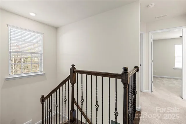a view of a hallway with windows