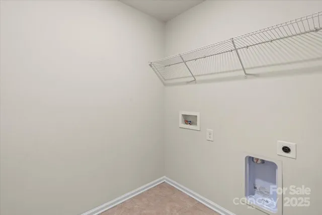 a view of storage and utility room with a fan