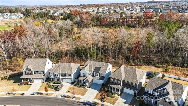 an aerial view of a house with outdoor space
