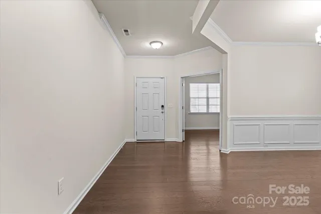 a view of entryway with wooden floor