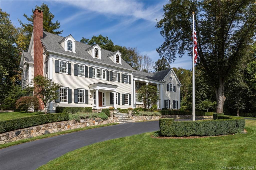 10 Lee Road Ridgefield, CT 06877 - Photo 1 of 1 a front view of a house with a garden