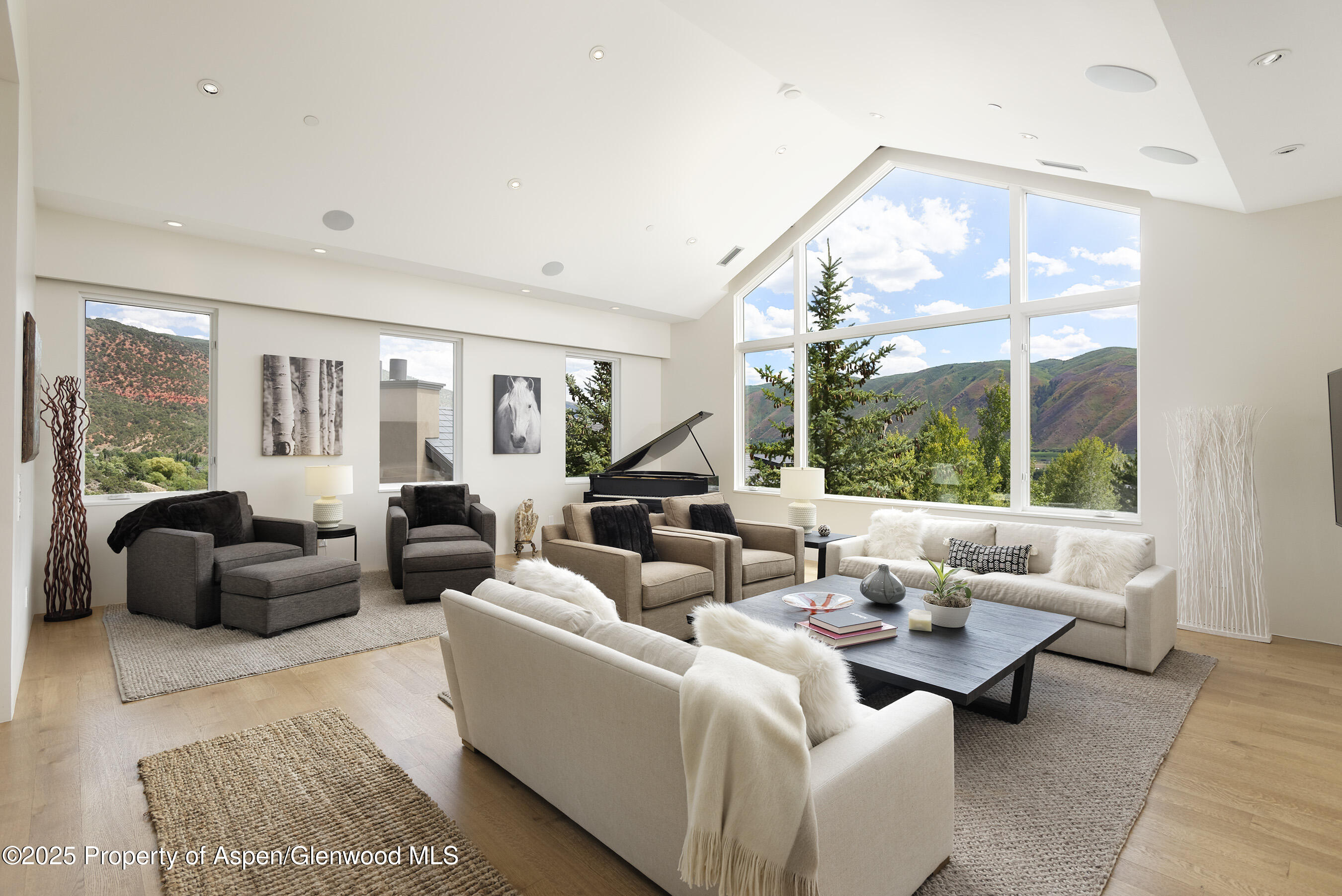 751 Promontory Lane Basalt, CO 81621 - Photo 1 of 41 a living room with furniture and a large window