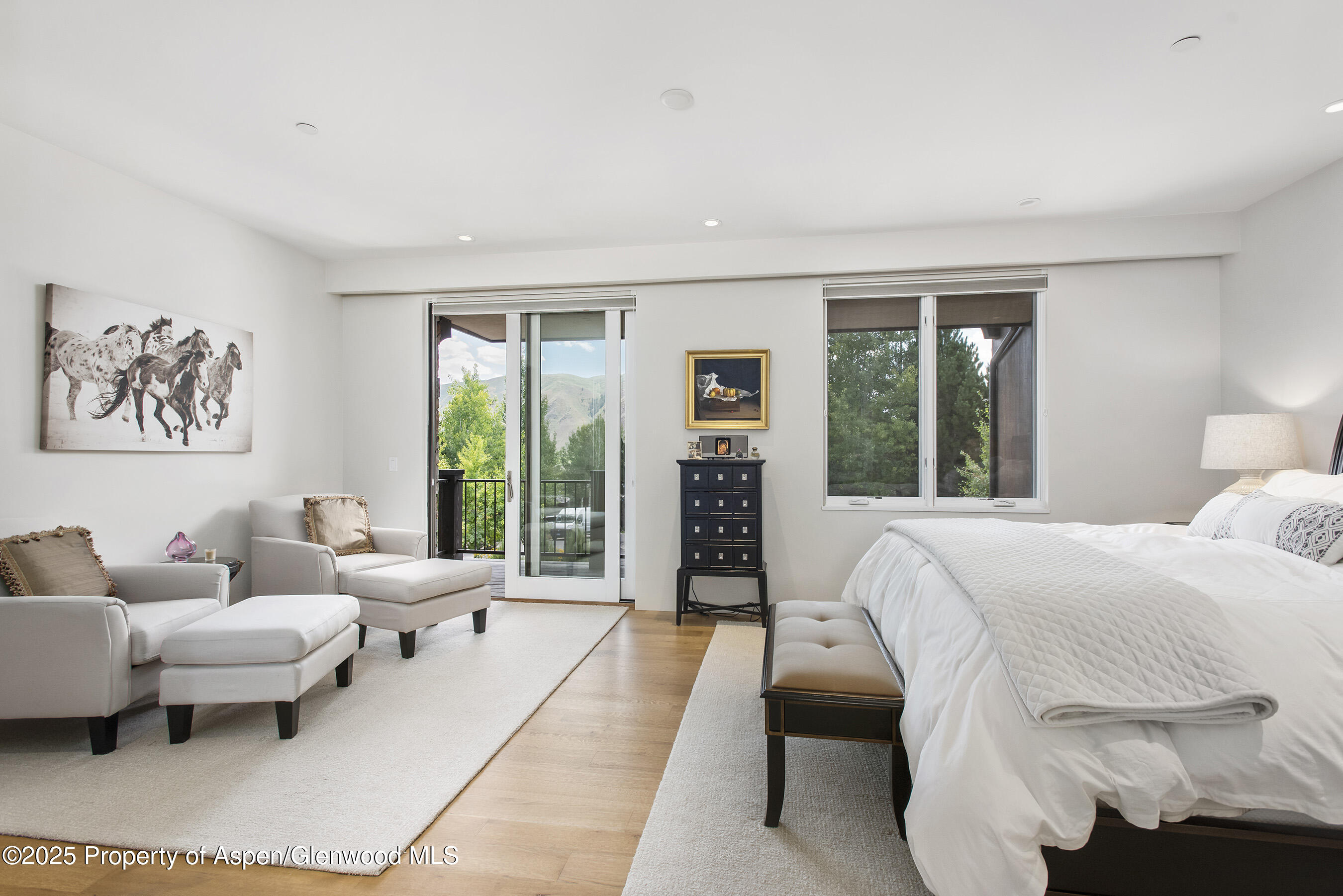 751 Promontory Lane Basalt, CO 81621 - Photo 12 of 41 a bedroom with a large bed couch and a large window
