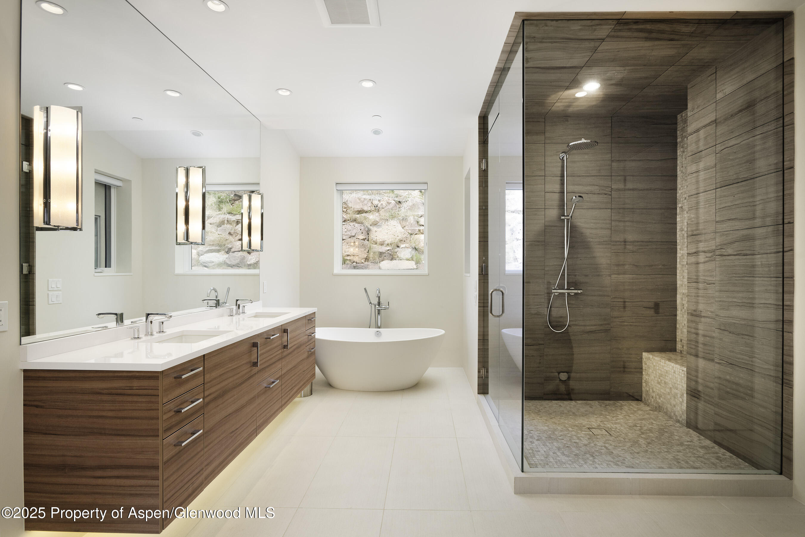751 Promontory Lane Basalt, CO 81621 - Photo 14 of 41 a bathroom with a double vanity sink toilet and shower