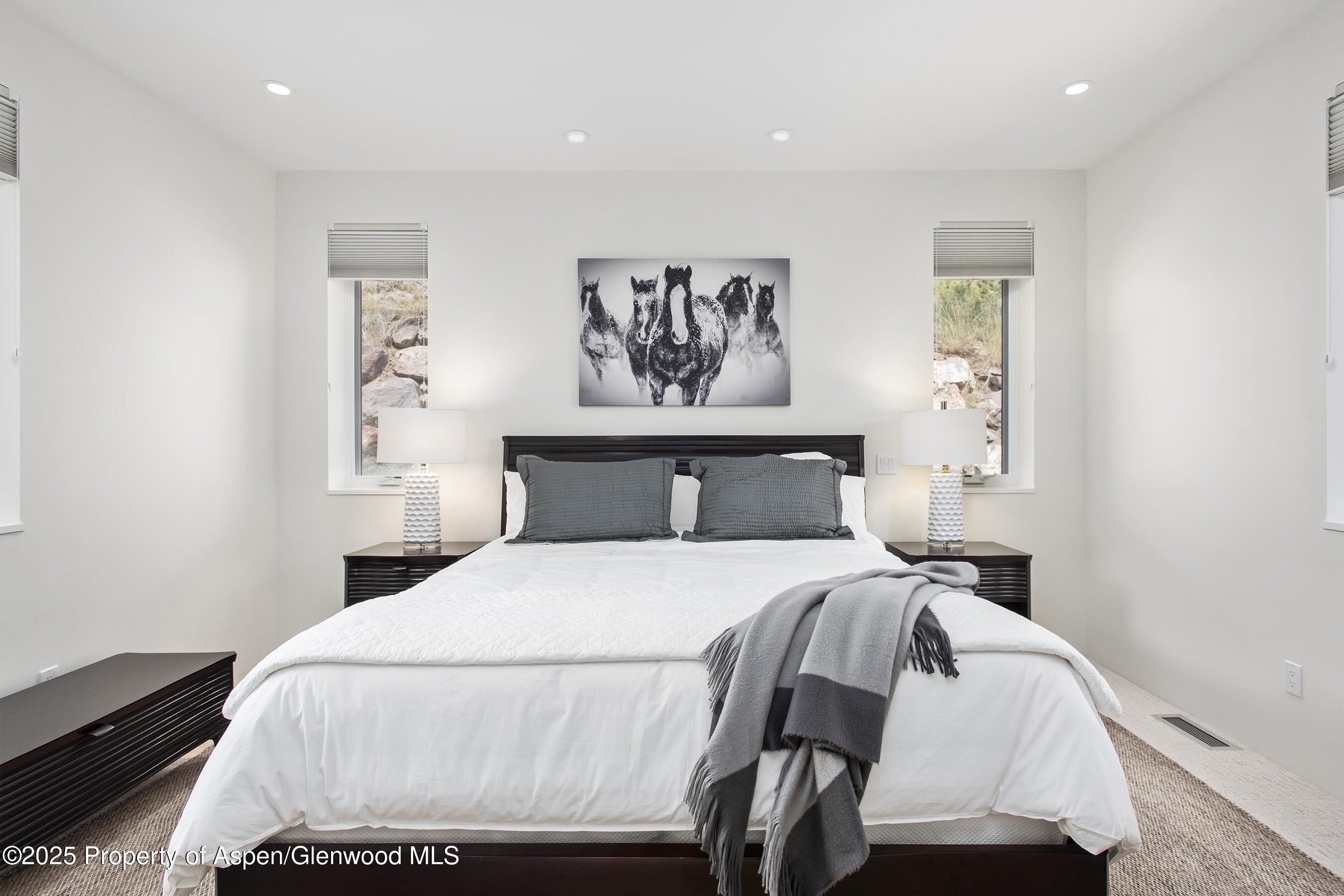 751 Promontory Lane Basalt, CO 81621 - Photo 19 of 41 a bedroom with a bed and wooden floor